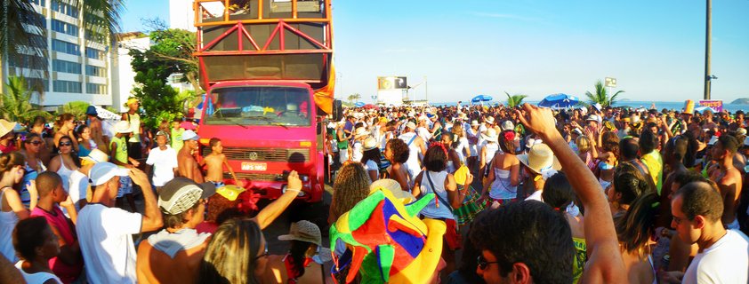 Carnival street party with sound truck and crowd at Rio de Janeiro beach, Brazil