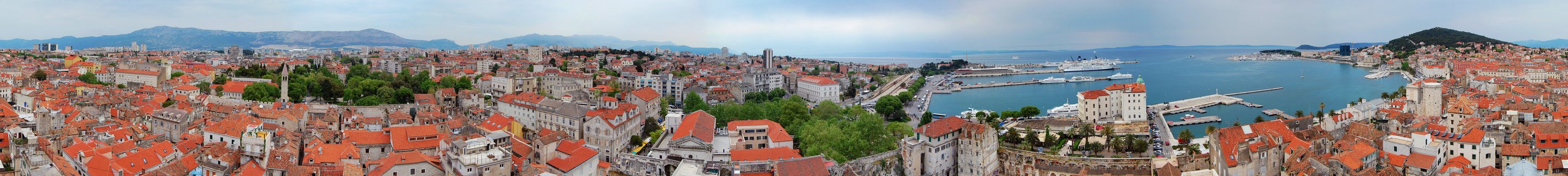Aerial panoramic view of Split's historic old town with red rooftops and Adriatic Sea harbor, Croatia