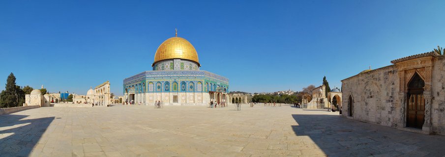 The Dome of the Rock shrine with its golden dome and blue tiled walls on the Temple Mount plaza in Jerusalem under clear blue sky