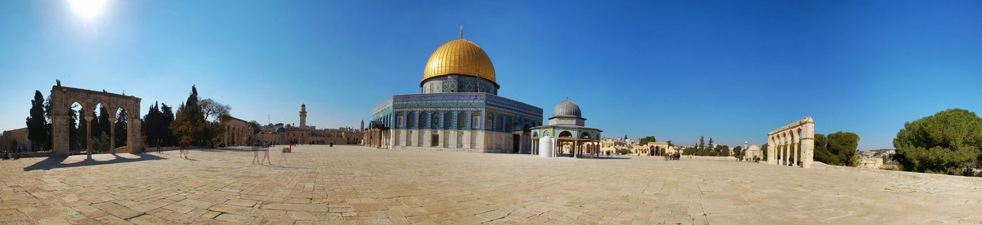 The Dome of the Rock mosque with its golden dome and blue tiled walls on the Temple Mount in Jerusalem under a clear blue sky