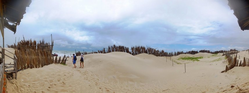 Sand dunes and beach access path with erosion control fences in São Luís, Maranhão, Brazil