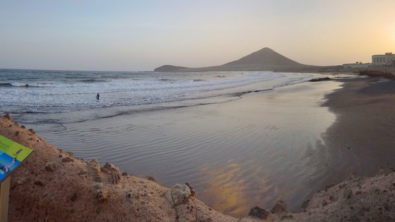 El Médano beach at sunset with Montaña Roja volcanic cone, Tenerife, Canary Islands, Spain