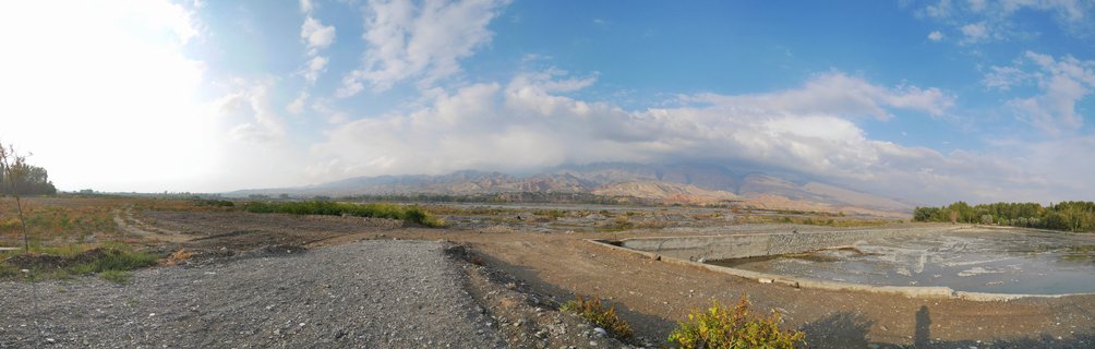 Fish farm ponds in arid mountain landscape near Panjakent, Sughd Province, Tajikistan, Central Asia