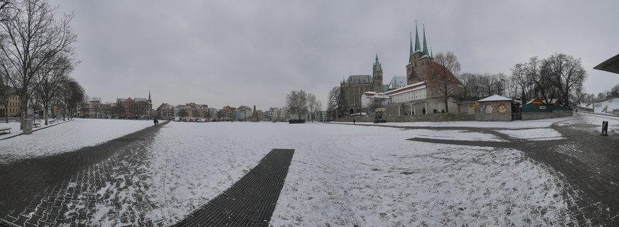 Erfurt Cathedral twin spires rise over snow-covered city from Petersberg Citadel, Germany