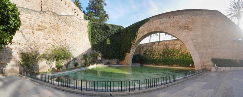Bellver Castle courtyard with moat and stone archway, Palma de Mallorca, Spain