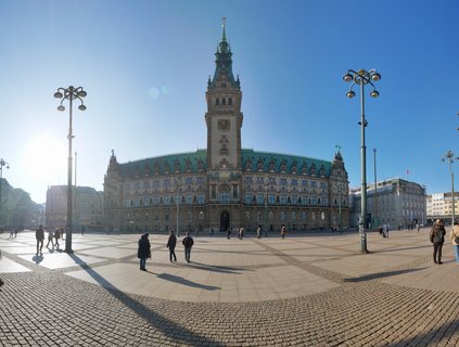 Hamburg Rathaus (City Hall) with clock tower and pedestrians on Rathausmarkt square, Hamburg, Germany