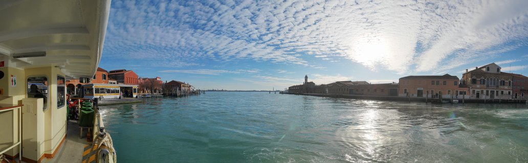 Venice Grand Canal view from vaporetto water bus with historic buildings and San Giorgio Maggiore bell tower