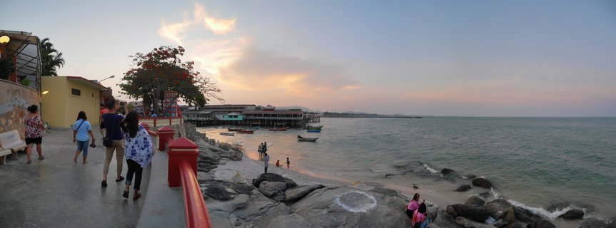 Sunset at Hua Hin Fishing Village Pier with Locals and Traditional Boats, Thailand