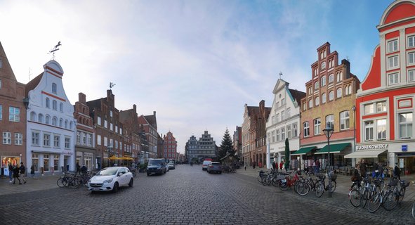 Historic cobblestone street with gabled buildings in Lüneburg, Germany